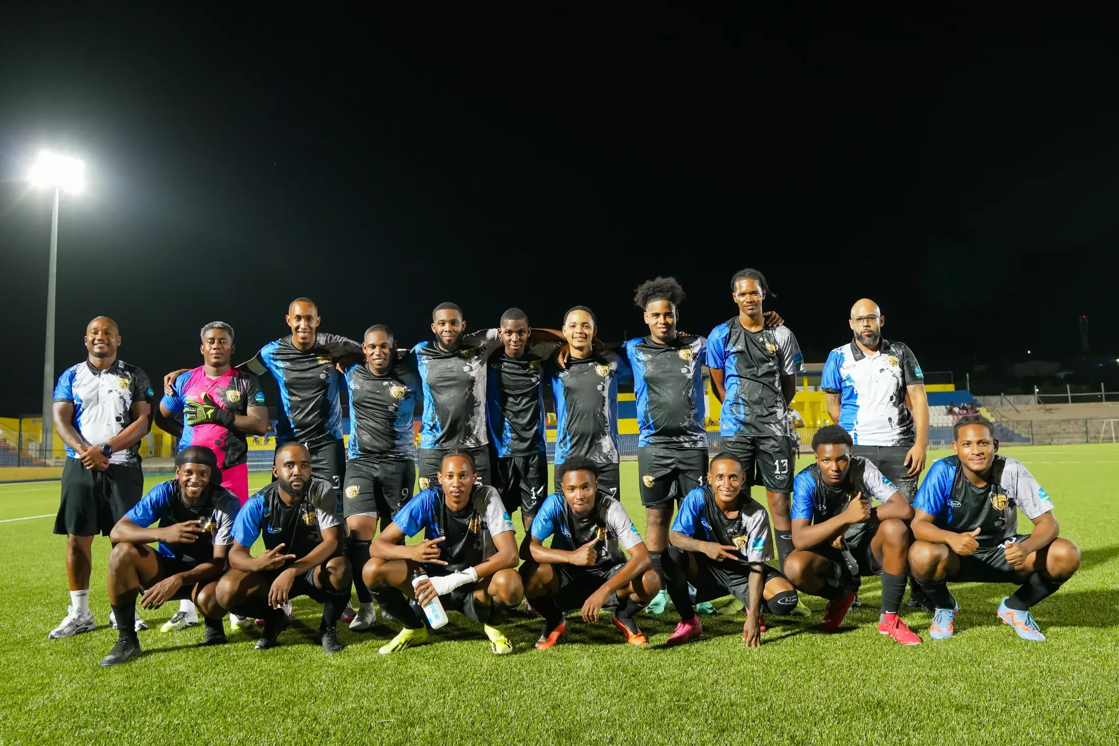West Wolves United players and staff together on the pitch; general club photograph